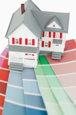 Close up of a maniature house and a color chart clipart