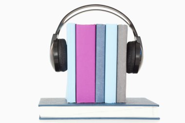 Headphones around books clipart