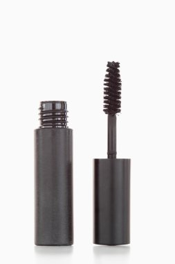 A black tube and brush of mascara clipart