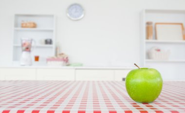 An apple on a tablecloth clipart