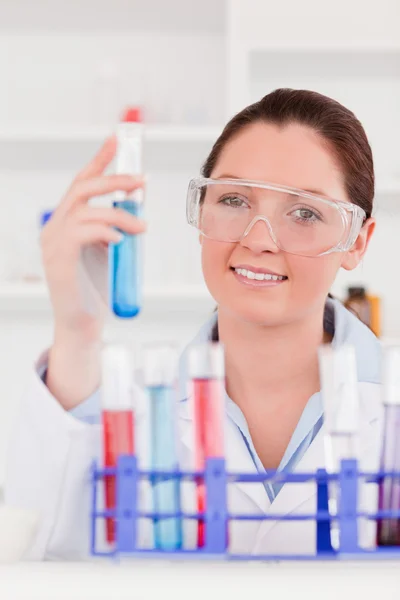 Portrait of a cute scientist storing a test tube — Stock Photo, Image