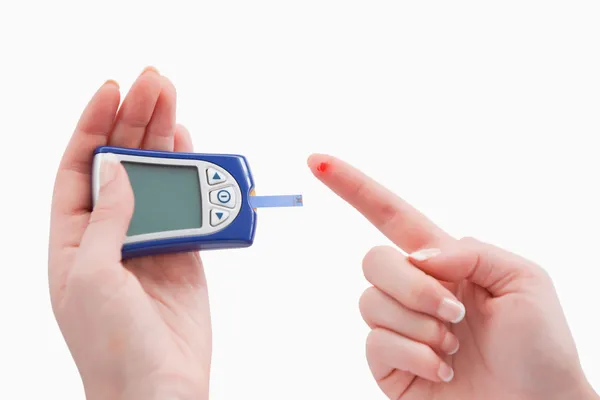 Close up of a blood glucose meter utilization — Stock Photo, Image
