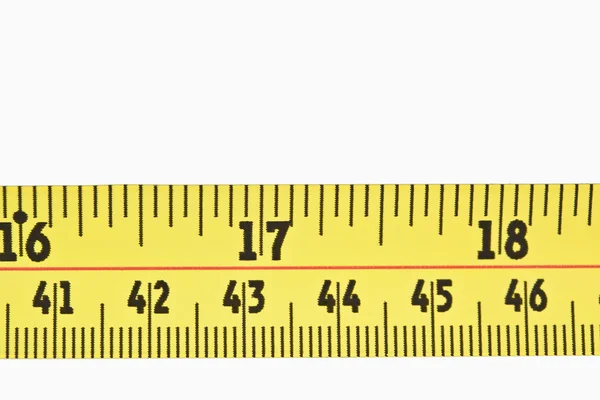 Close up of a part of a yellow measuring tape — Stock Photo, Image