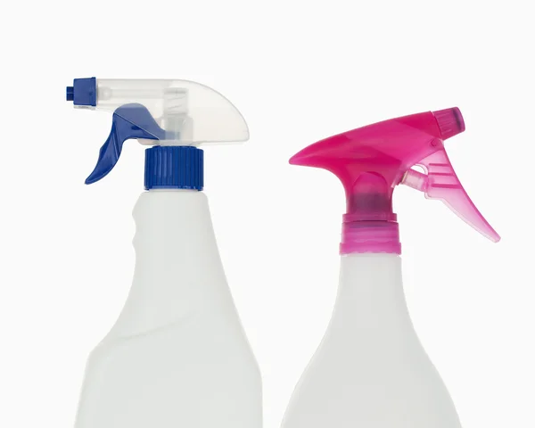 Close up of a pink and a blue spray bottles — Stock Photo, Image