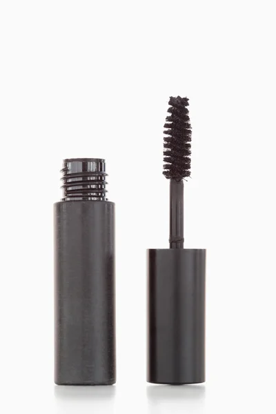 A black tube and brush of mascara — Stock Photo, Image