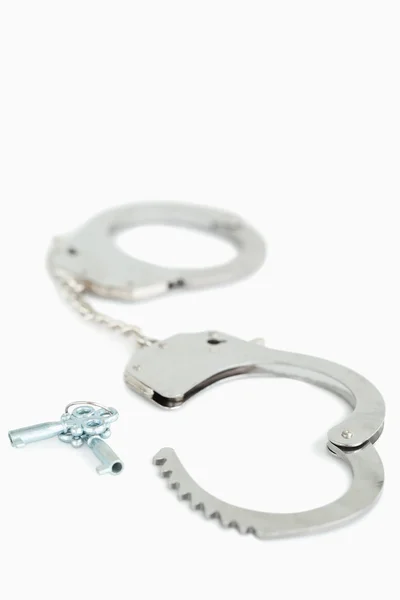 Portrait of handcuffs and keys — Stock Photo, Image