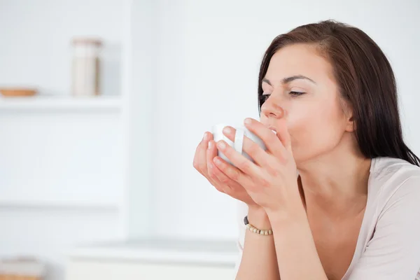 Close up of a brunette having a coffee — Stock Photo, Image