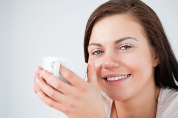 stock image Close up of a beautiful brunette enjoying a coffee