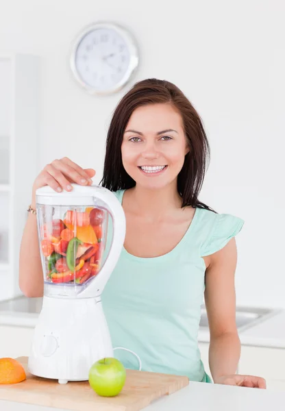 Charming woman posing with a blender — Stock Photo, Image