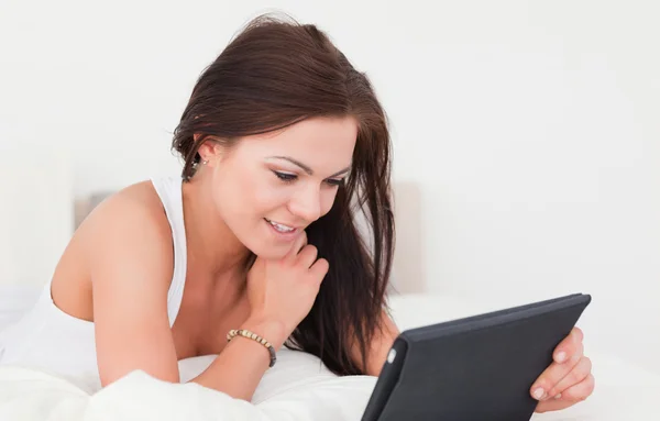 Brunette with a tablet — Stock Photo, Image