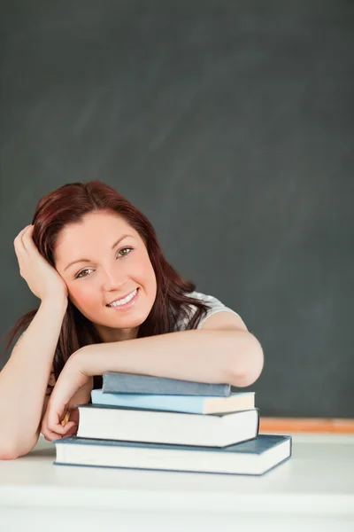 Young student with her forearm on her books Stock Image