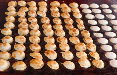 Freshly baked traditional Dutch mini pancakes called 