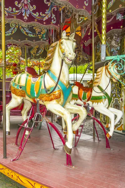 stock image Two colourful horses in a vintage (old fashioned) carousel