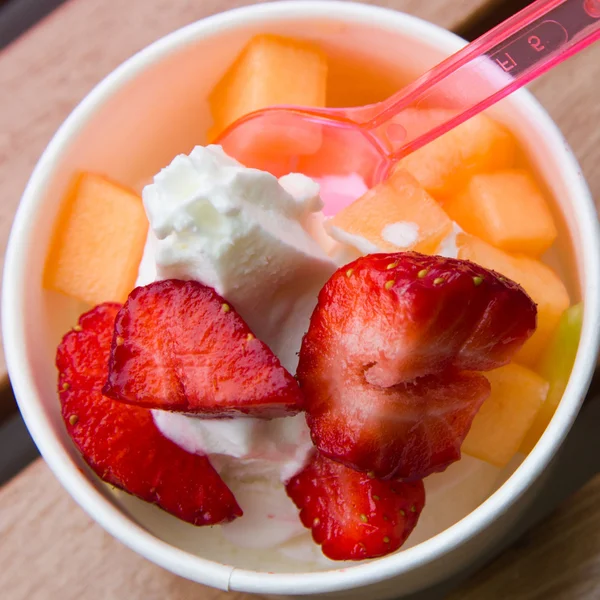 stock image Delicious ice cream with strawberry and melon topping