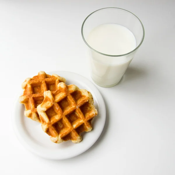 stock image Glass of milk and cookies on white background