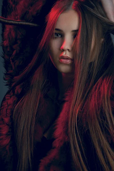 Portrait of a beautiful woman wearing fur — Stock Photo, Image