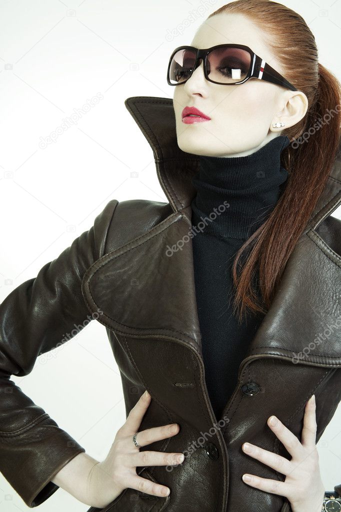 Portrait of a beautiful woman wearing glasses and a jacket
