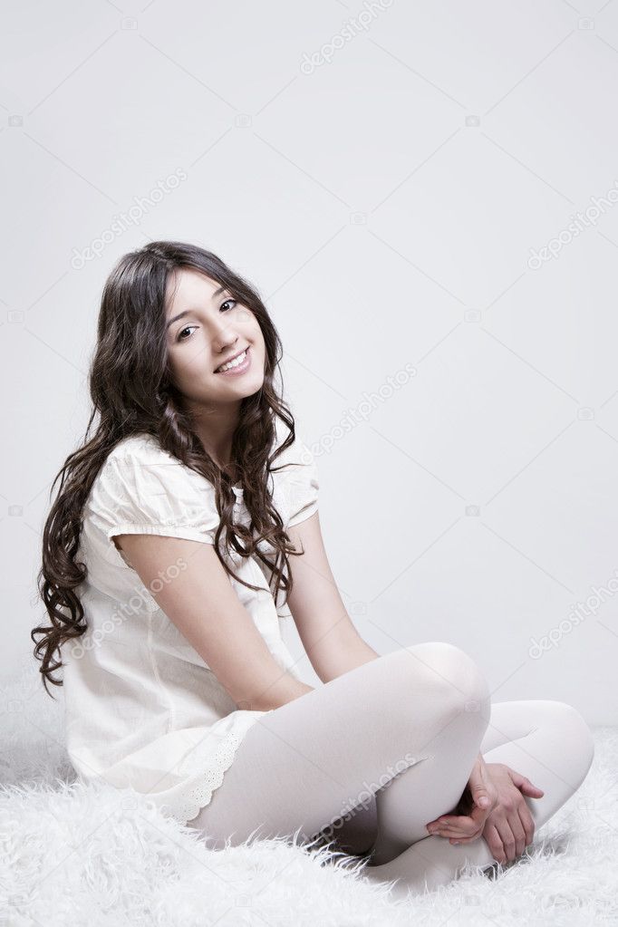 Beautiful smiling girl with perfect skin and hair