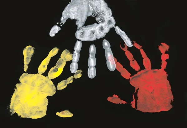 stock image Set of colorful hand prints on black