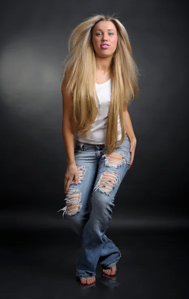 stock image Woman in old blue jeans is dancing