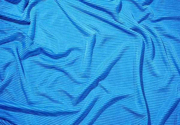 Blue rippled cloth as background — Stock Photo, Image