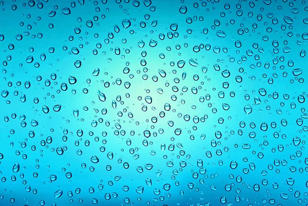 Beautiful blue water drops on glass — Stock Photo, Image