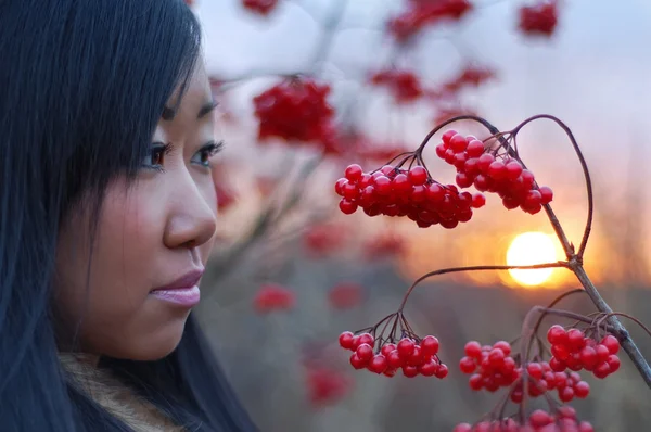 Beautiful woman look on berry — Stock Photo, Image