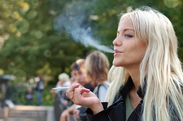 stock image Girl smoking outdoors