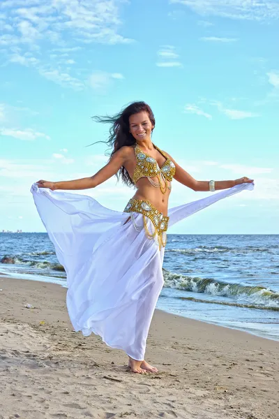 Beautiful woman dancing in white indian dress — Stock Photo, Image
