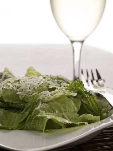 Ceasar salad and white wine — Stock Photo, Image
