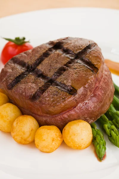 Tenderloin steak in a white plate — Stock Photo, Image