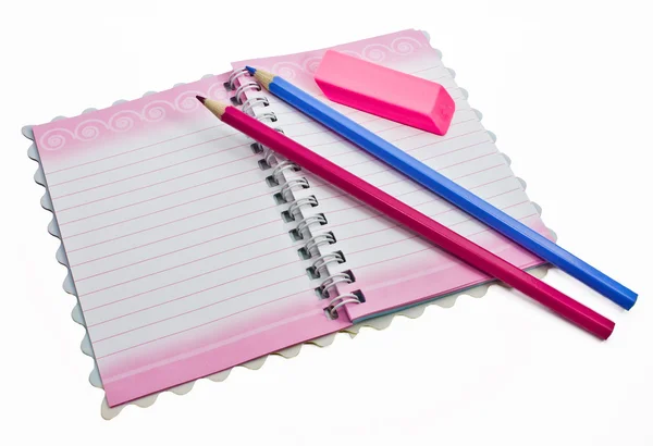 Uma borracha de lápis, um caderno — Fotografia de Stock