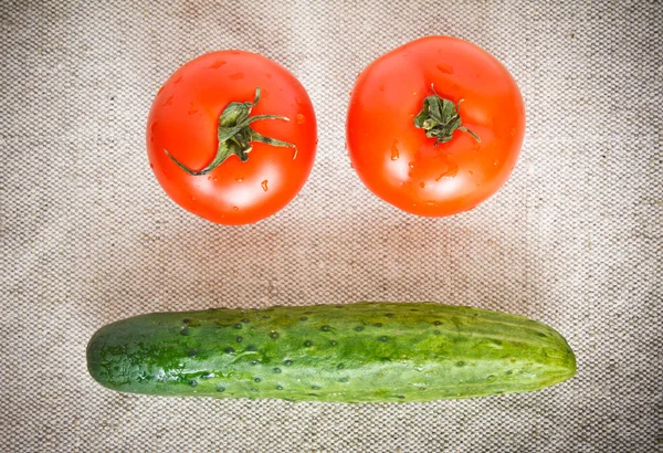 stock image Two Tomatoes and Cucumber on the sacking background