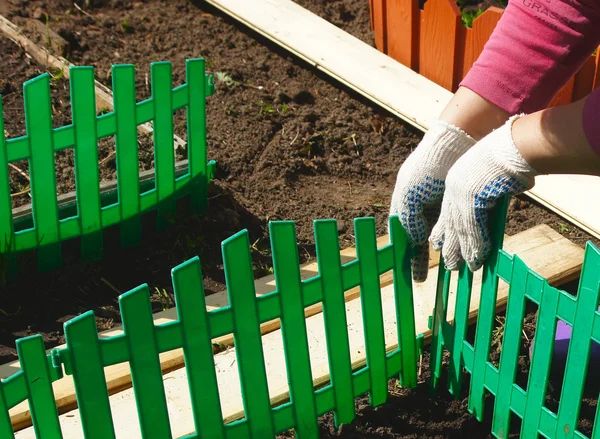Green plastic fencing — Stock Photo, Image
