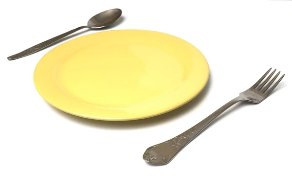 Enchufe y cuchara en un plato — Foto de Stock