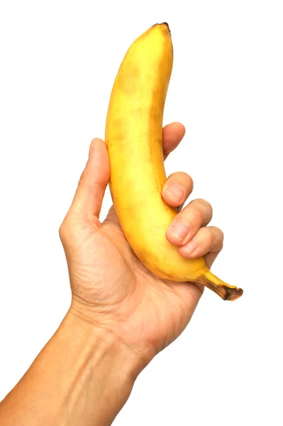Un uomo che tiene una banana isolata su sfondo bianco — Foto Stock