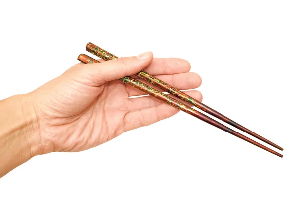 Chopsticks in a hand — Stock Photo, Image