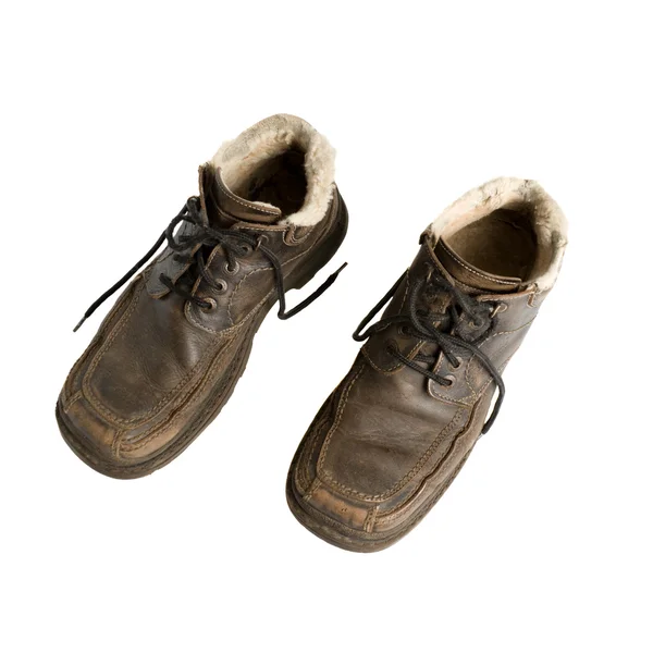 Špinavé zimní boty na bílém pozadí — Stock fotografie