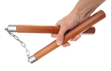 Nunchaku in a hand to isolate on the white clipart