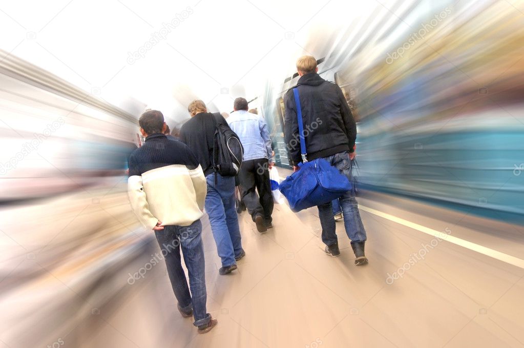 Passengers walking at subway station