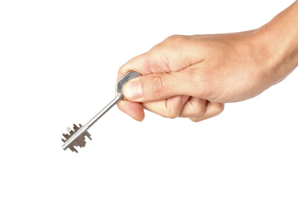 Metallschlüssel in der menschlichen Hand, isoliert auf dem weißen — Stockfoto