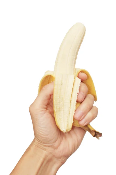 Банан в человеческой руке, изолированный на белом — стоковое фото