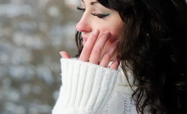 stock image Outdoor portrait of a young pretty brunette wearing a white warm