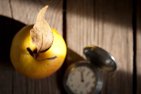Apple and old pocket watch. — Stock Photo, Image