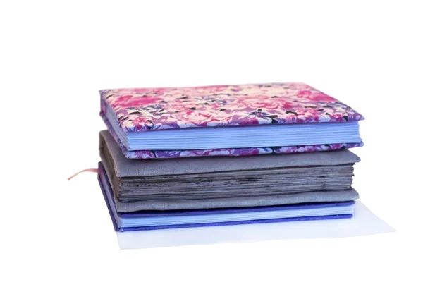 Tres cuadernos a mano sobre fondo blanco — Foto de Stock