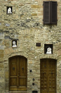 Statues in wall nooks, Italy clipart