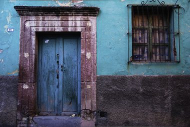 Rustic colorful door in the town of San Miguel de Allende, Mexic clipart