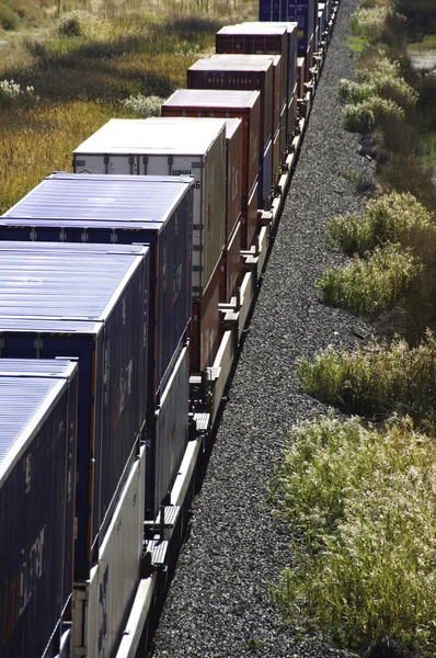 stock image Freight train in the desert mountains.