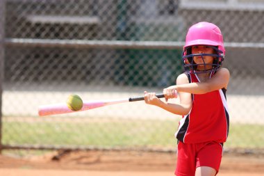 Girl Playing Softball clipart