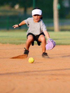 Young Girl Playing Softball clipart